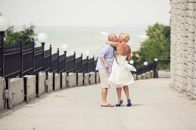 Casual Bride & Groom Kiss in Front of Beach