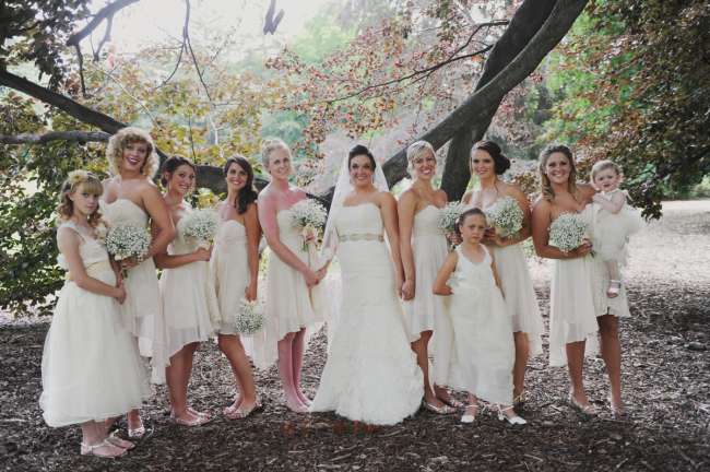 Bride With Bridesmaids in High-Low Dresses & Baby's Breath Bouquets