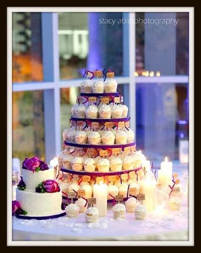 Cupcake tower surrounded by candles