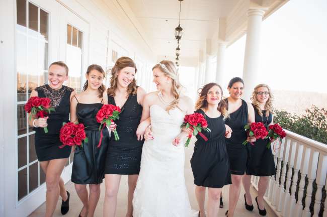 Bridesmaids wear black with a hint of red