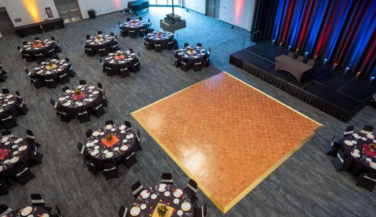 View of Mendel Center Grand Upton Hall from catwalk; dance floor; set tables