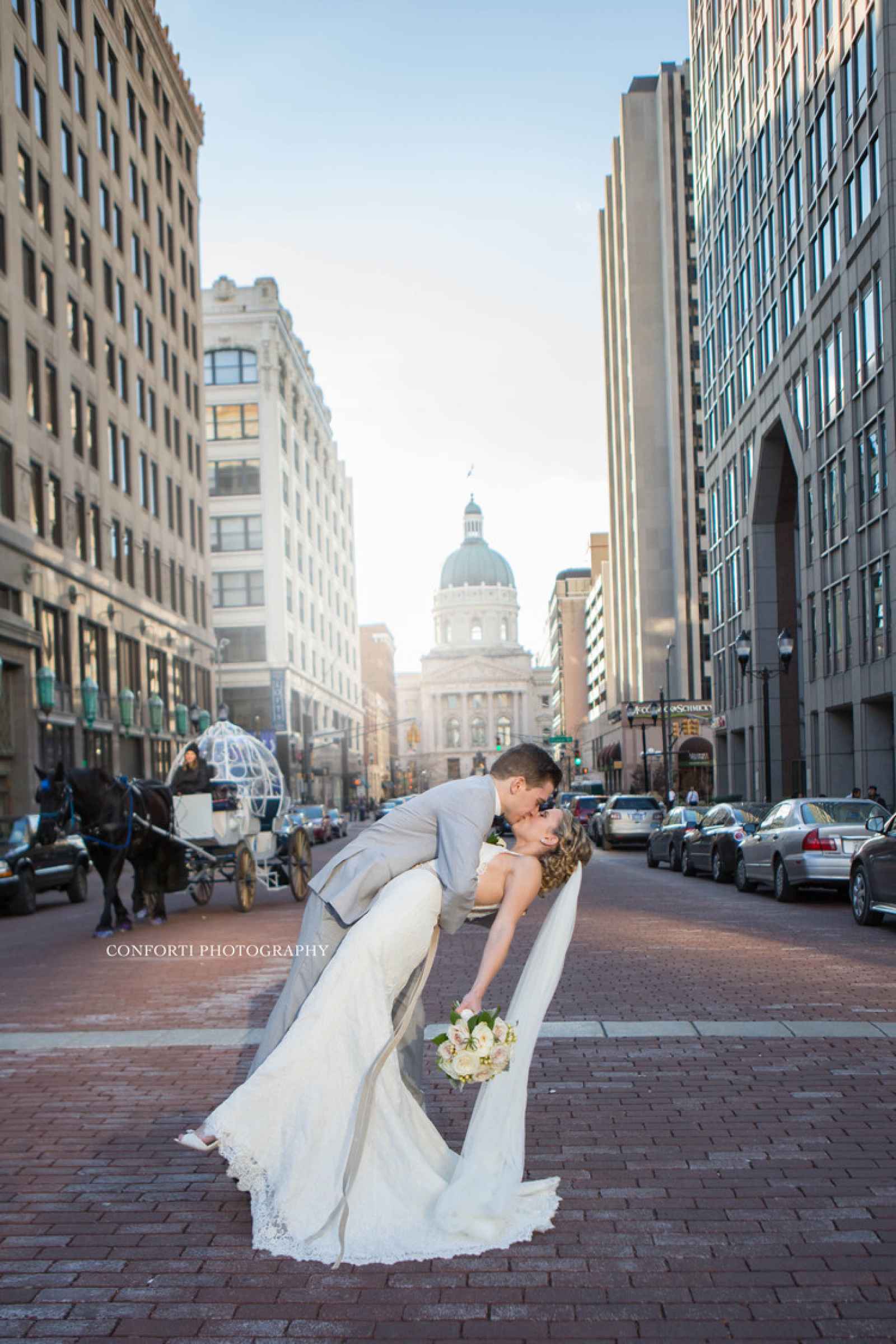 kissing in front of cityscape