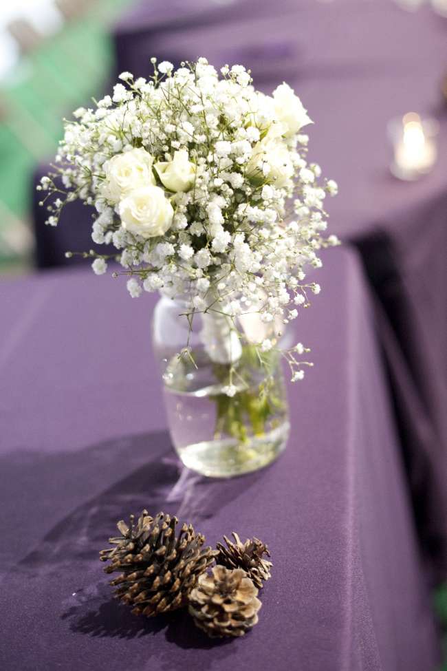 Pinecones Next to White Rose & Baby's Breath Bouquet