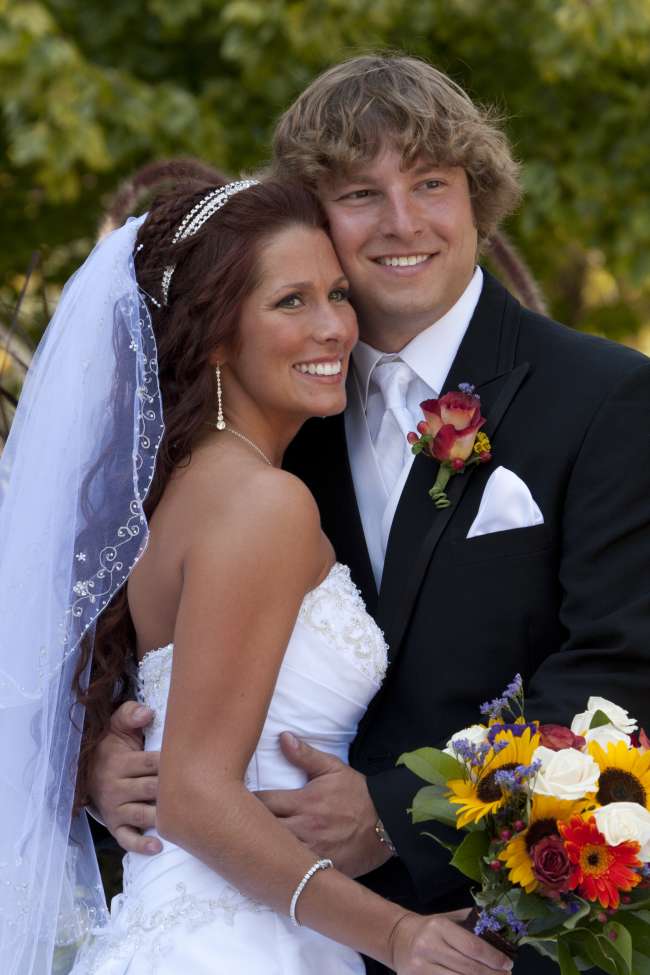 Couple poses for videographer