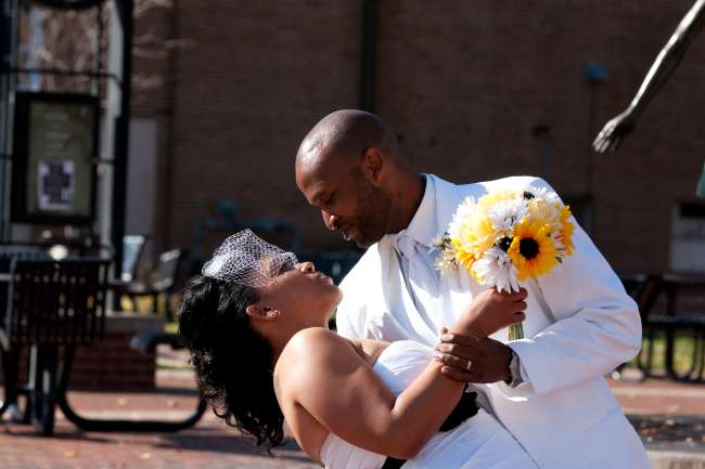 Groom Dips the Bride While Dancing Outside