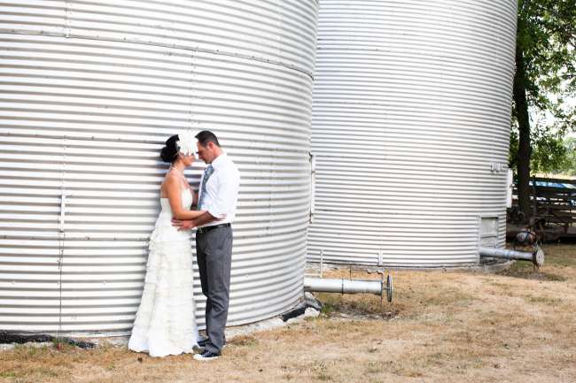 Bride & Groom Posing in Front of Silos
