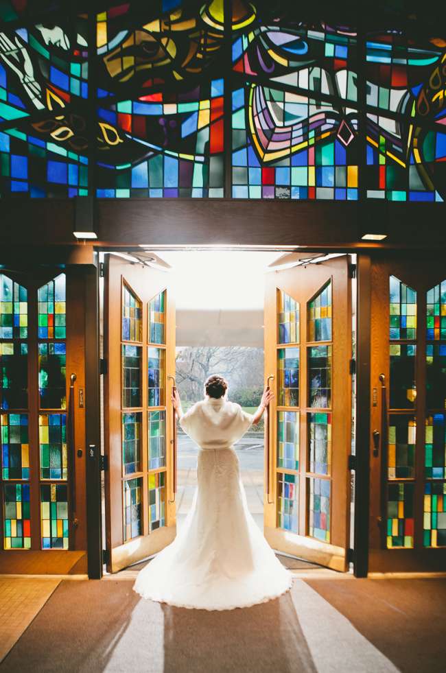 Dramatic Shot of a Bride With Stained Glass Windows