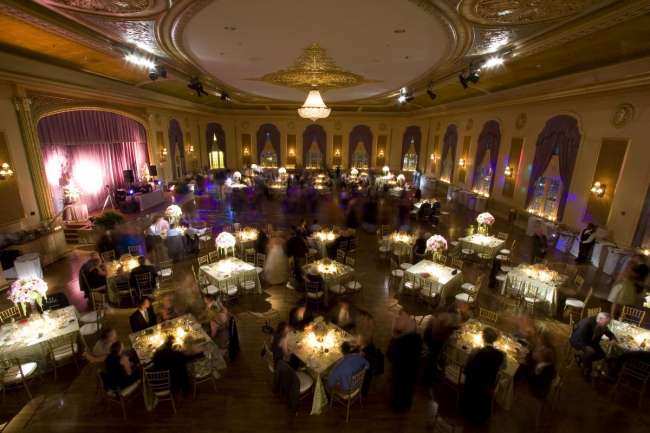 Reception square tables for 8 with dramatic lighting
